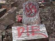 Photo: grave site with graffiti