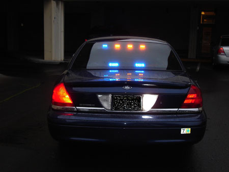 Photo of unmarked police vehicle rear view