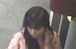 This woman was seen at an ATM shortly before a fire started in the machine's trash receptacle.