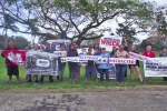 group of sign wavers facing camera