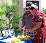 Image of a man and a woman lighting candles