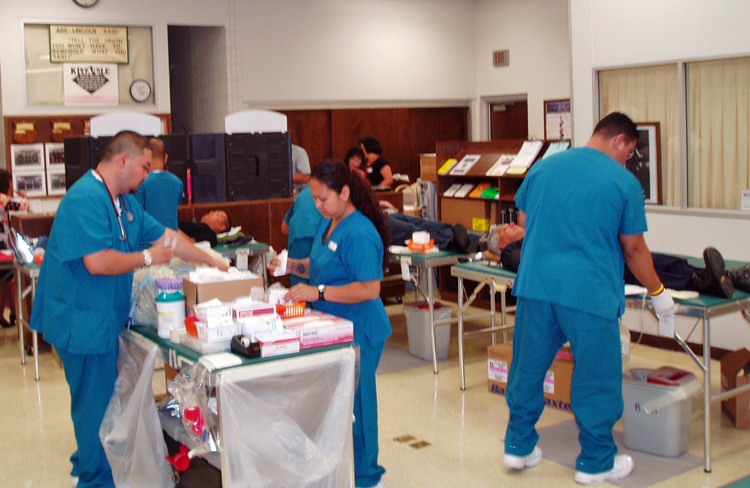Photo of blood donors & nurses
