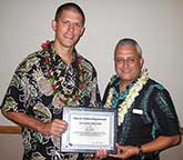 Image: Buyten and Tavares holding plaque