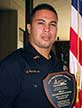 Image: Fontes holding plaque