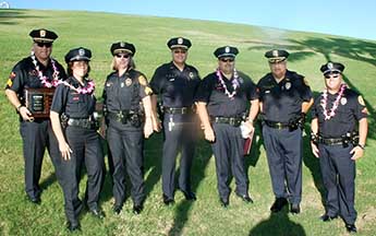 Photo: group shot on a grassy hill