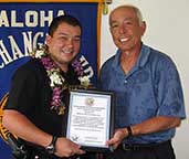 Image: Matsuda and Estrella with framed award.