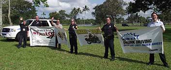 Image: six persons waving signs