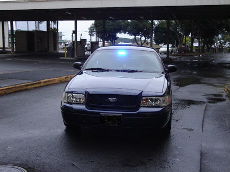 Photo of unmarked police vehicle front view