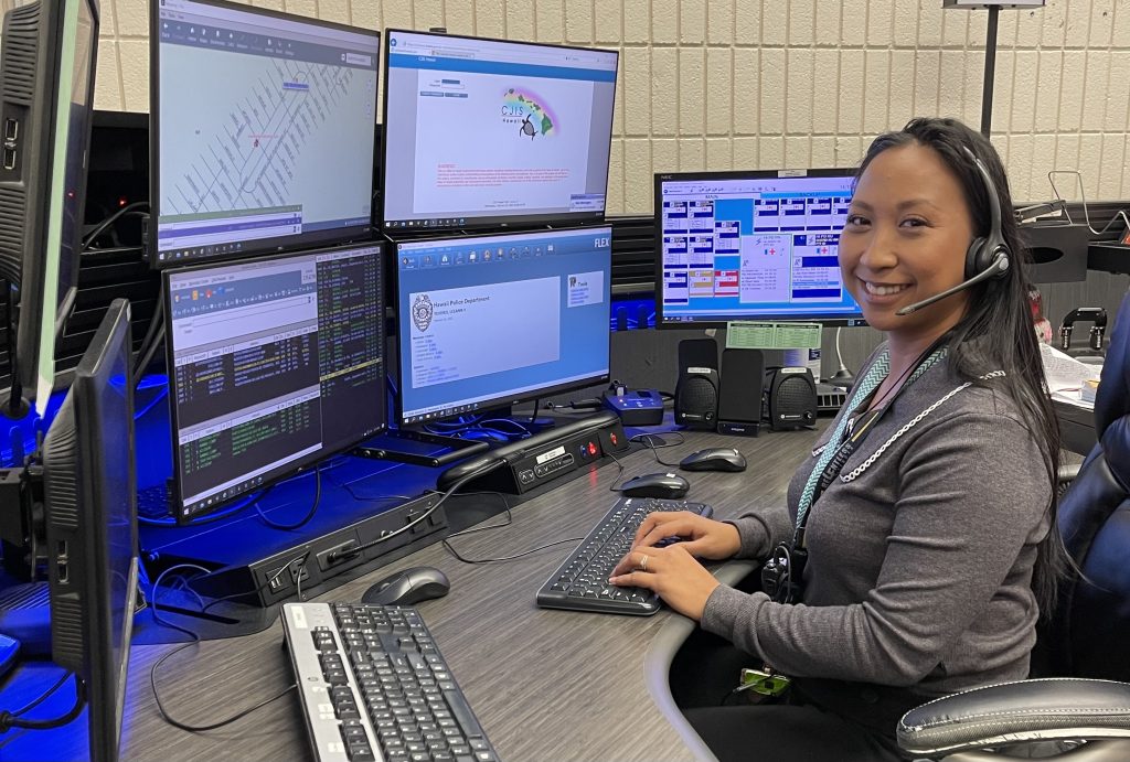 Image of a police dispatcher at her console