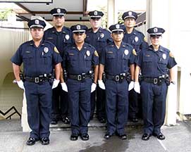 Photo: recruits standing in two rows wearing unforms with hats and gloves.