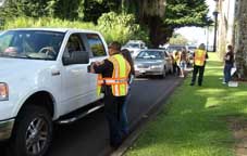 Uniformed officers and cars