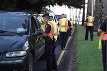 Image: officers and stopped motorists.