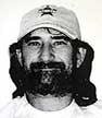 black-and-white close-up photo of green in a baseball cap