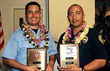 Image: Wong and Borwn hold plaques.