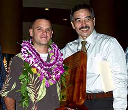 Photo: Prudencio and chief with award